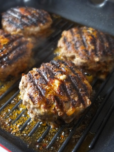 Smoked Cheddar Stuffed Aberdeen Angus Beef Burgers with Caramelized Red Onions